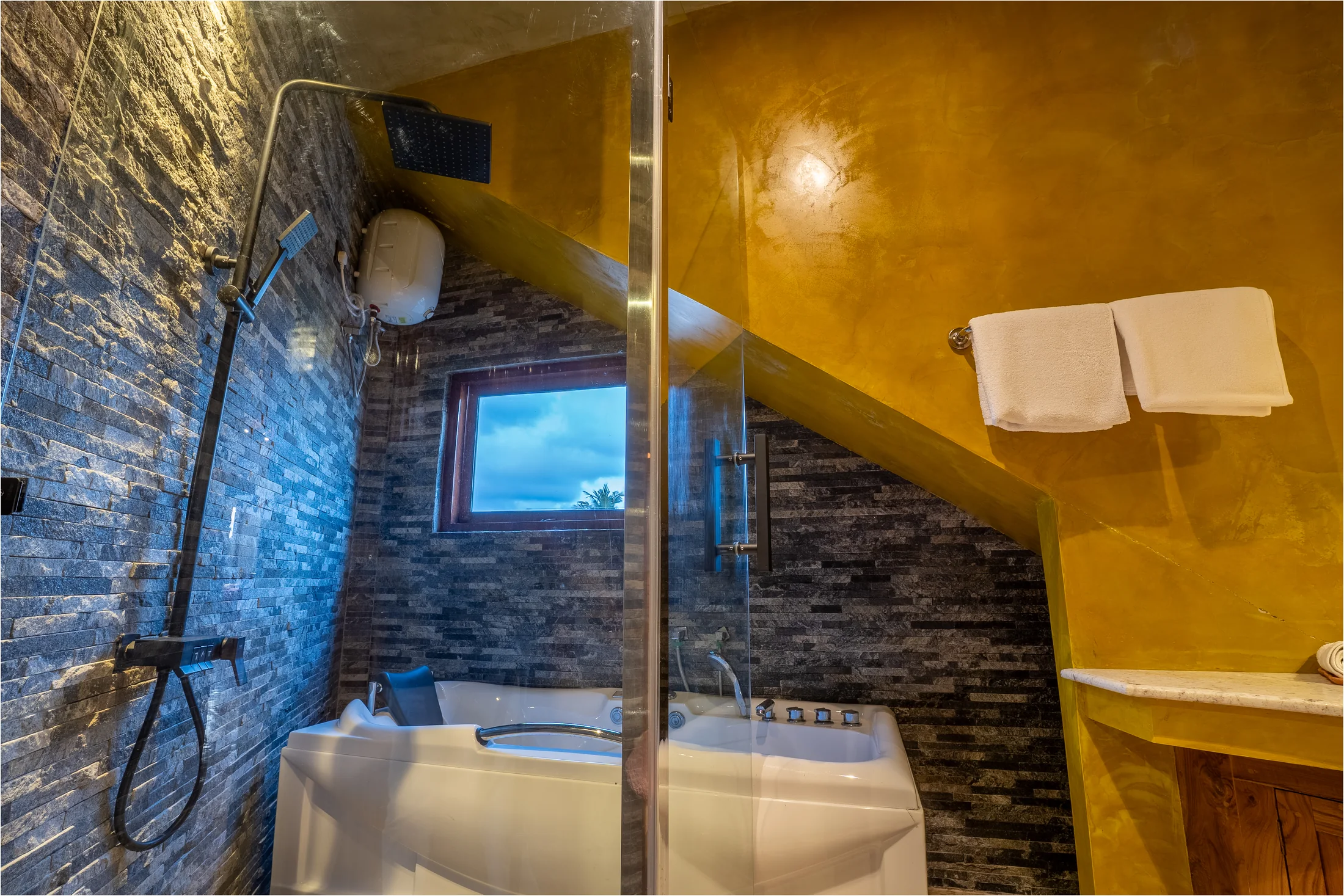 Sculptural stone basin in the private en-suite bathroom