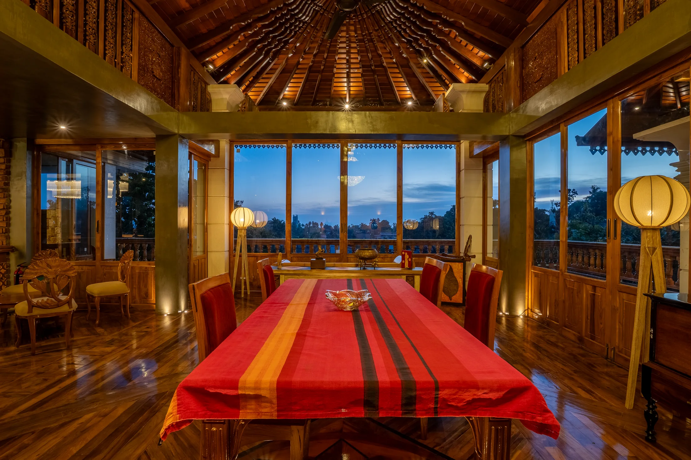 Private dining table beneath a soaring crafted timber roof