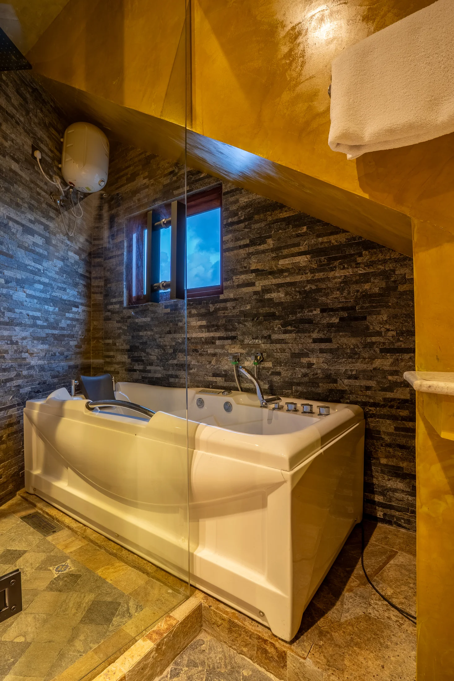 Sculptural stone basin in the private en-suite bathroom