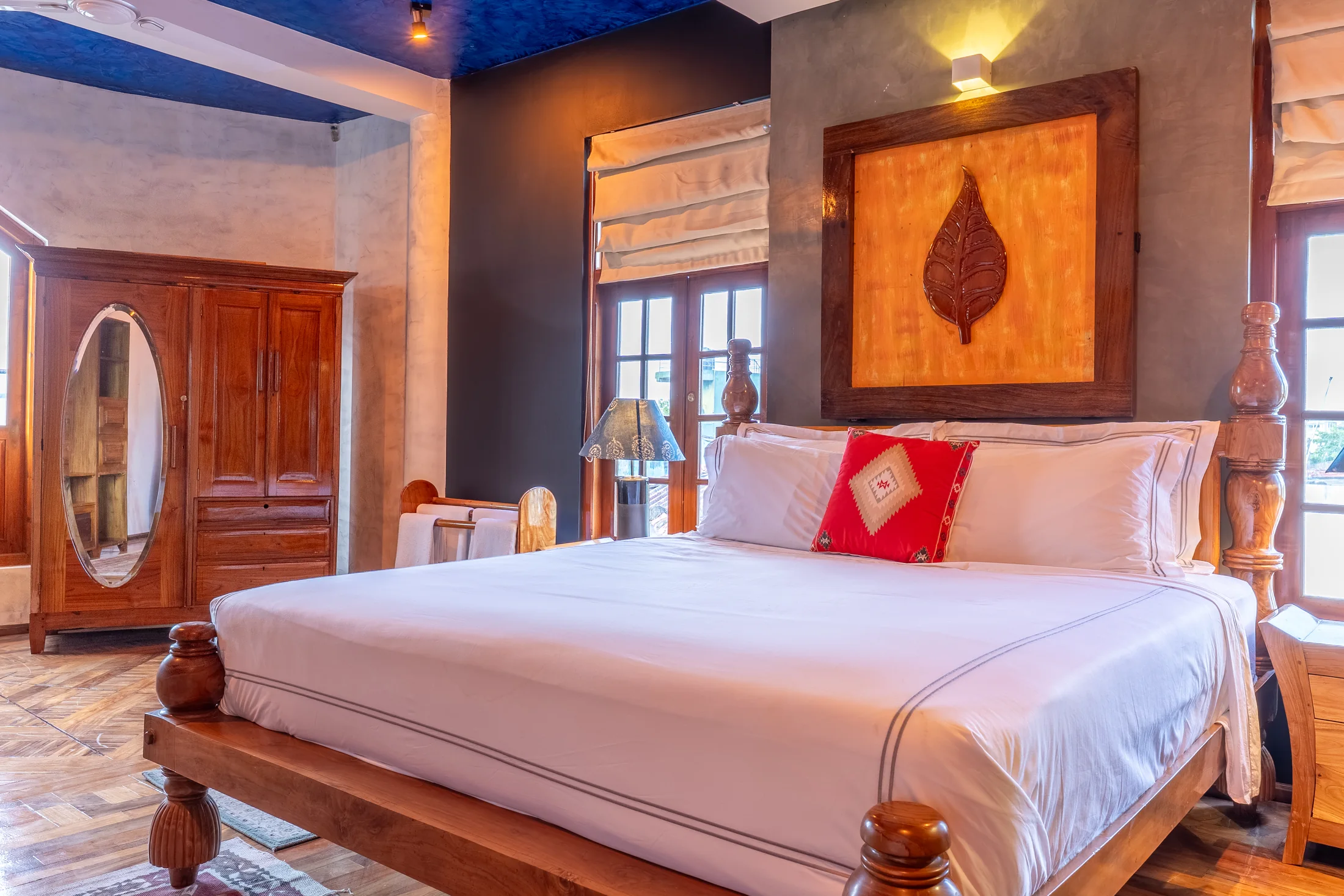 Private bedroom with polished wood floors and garden-facing windows