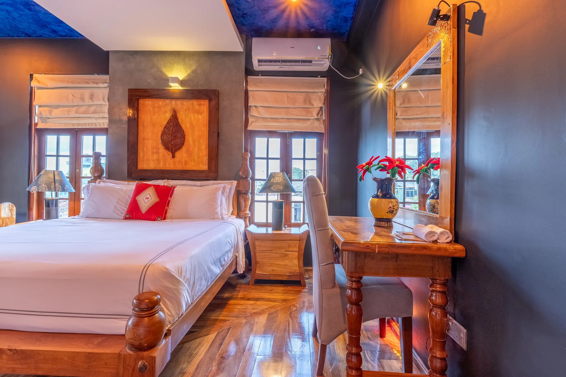 Warm bedroom detail with traditional carved furnishings