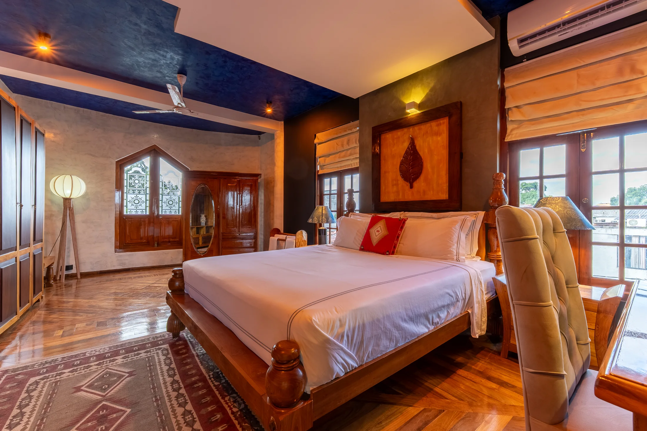 Serene bedroom framed by rich timber and soft natural light