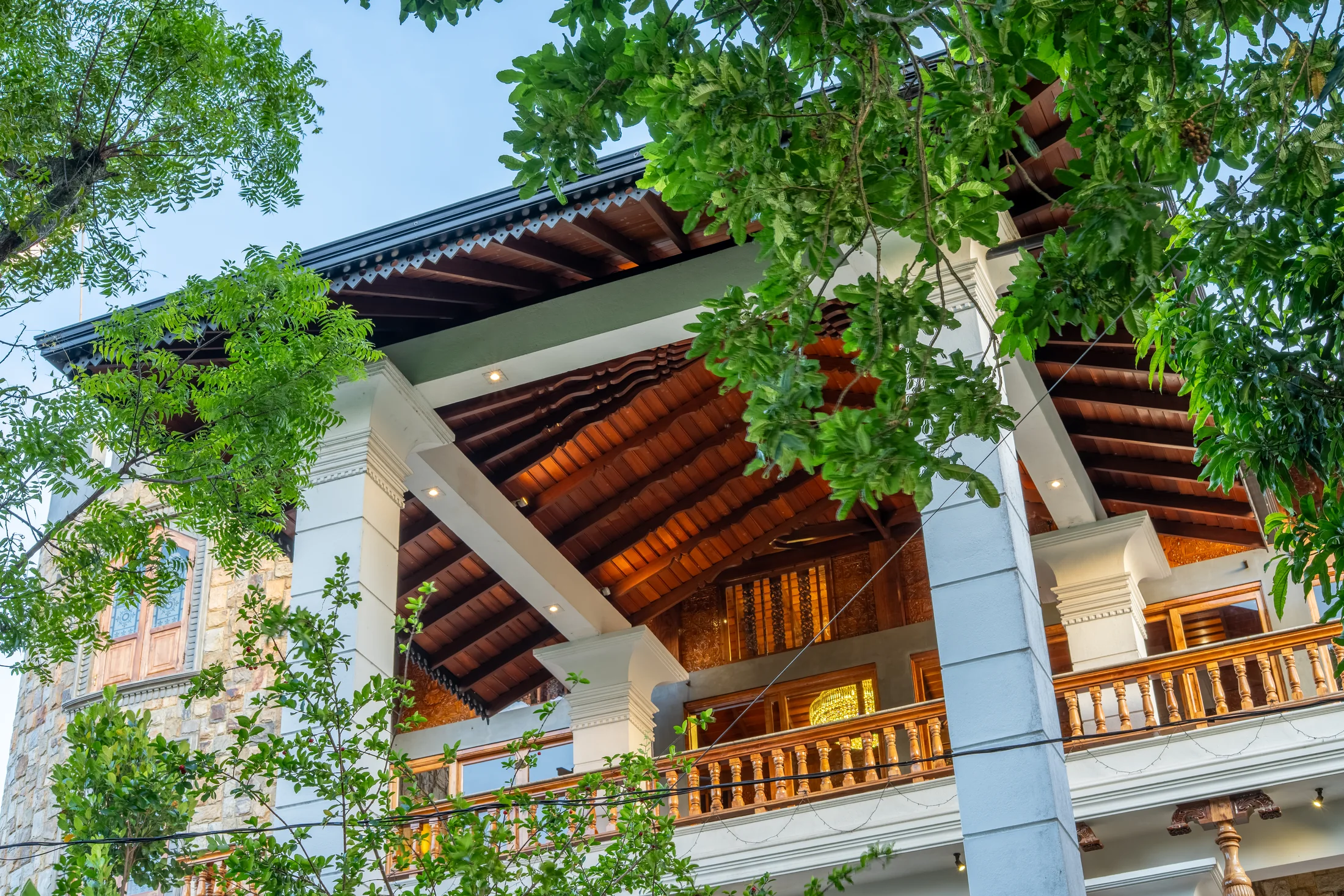 Red King residence rising through lush tropical greenery
