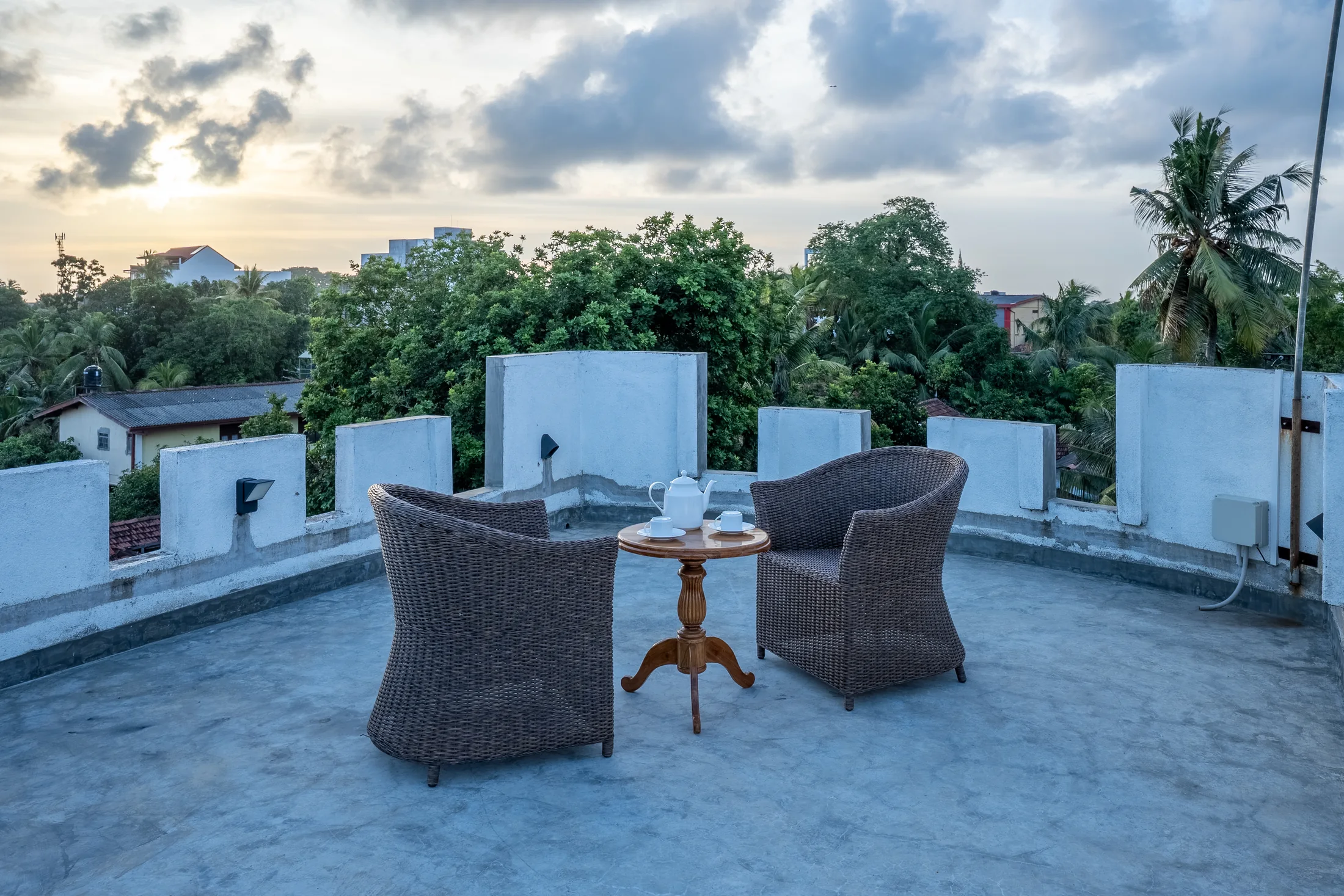 Open-air rooftop retreat beneath a softly lit sky